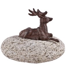 Lying deer on stone